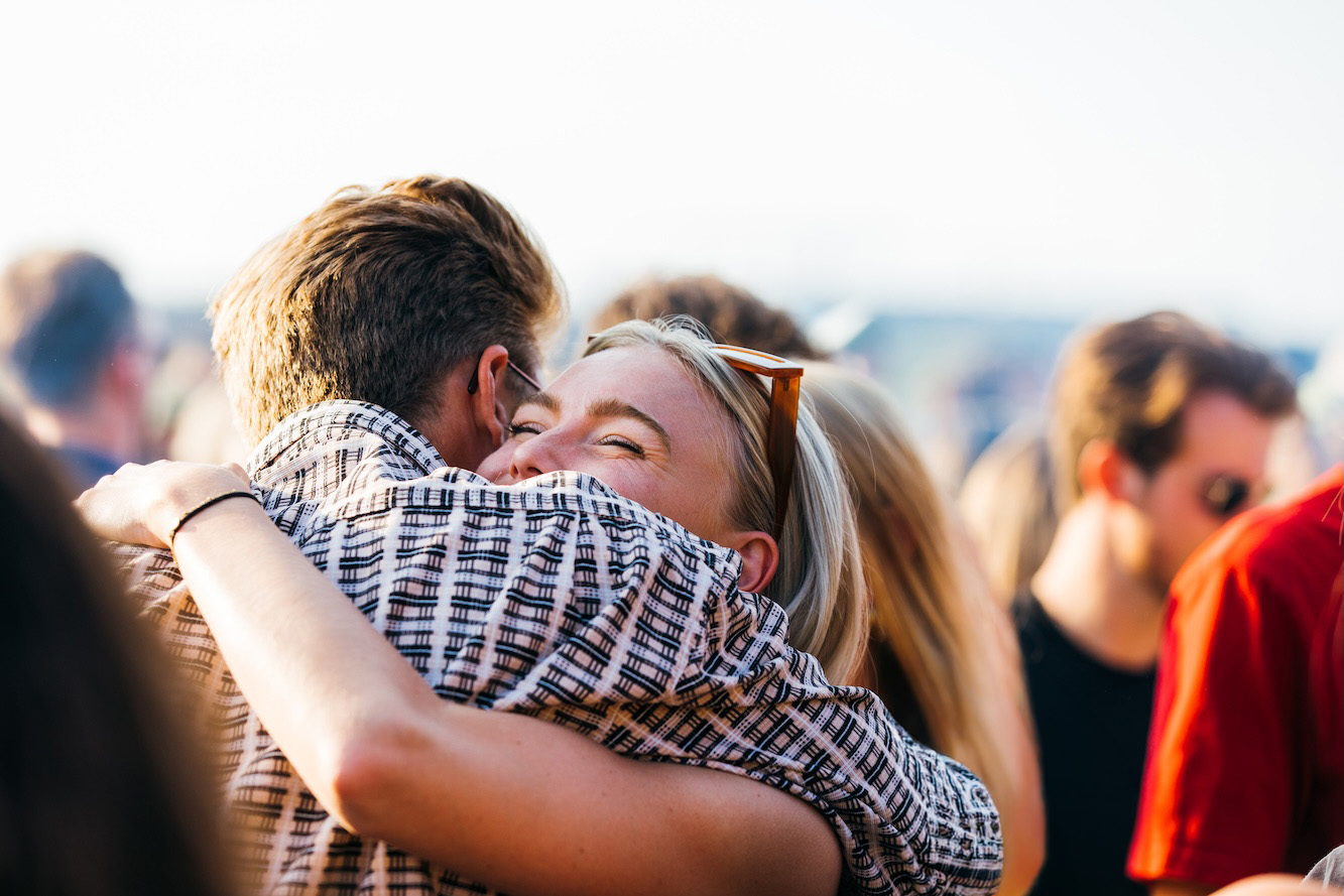 Festival crowd embrace — a moment of connection